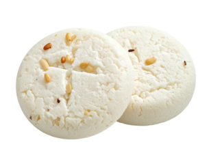 Two round, white cookies with a cross design and seeds