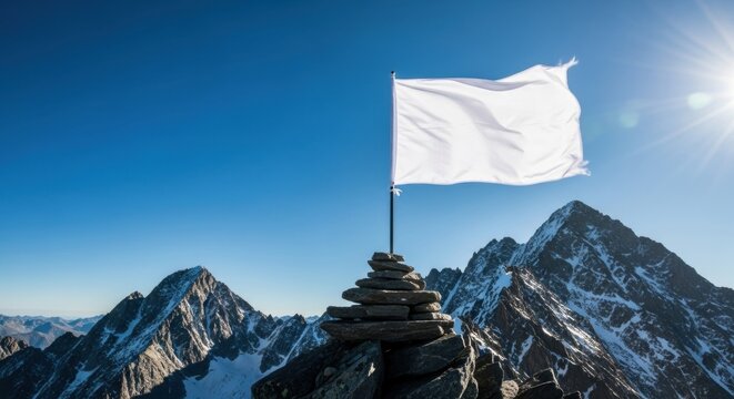 White flag waving on mountain peak. Surrender concept and symbol for peace. Victory and achievement sign.