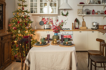 Classical Christmas decorated interior kitchen. Modern classic style interior design apartment dining room and Christmas tree with red golden ornament decorations. Christmas eve at home