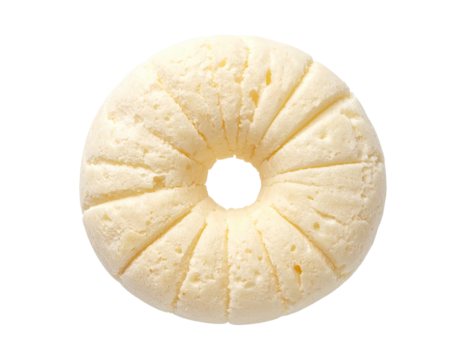 Round, light-yellow baked good with a scalloped edge and center hole