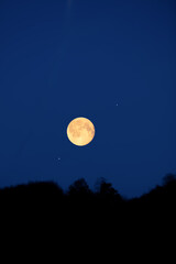 Full Moon, stars, planets and landscape scenery silhouettes.