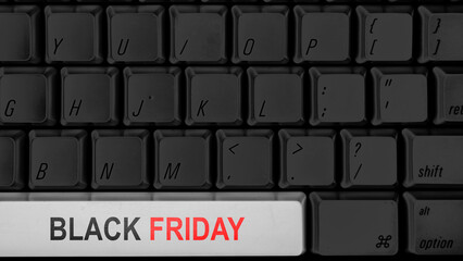 Closeup view of Black Friday text on the computer keyboard button. Copy space. Black Friday sale concept
