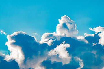 cumulus thick clouds in blue sky