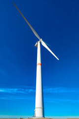 wind turbine on blue sky background, bottom view