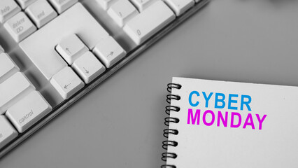 Closeup view of the text of Cyber Monday on a note on a gray background. Copy space. Cyber Monday sale concept