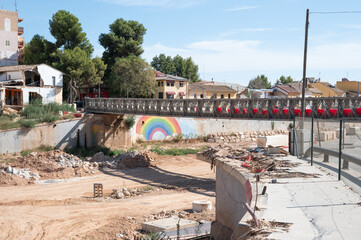 Damaged houses and bridge by Valencia flood aftermath, one year after the DANA floods