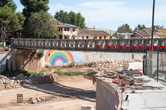 Temporary metal bridge in Pica&ntilde;a crossing Barranco del Poyo during reconstruction one year after the DANA floods in Valencia