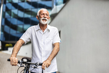 Portrait of a senior businessman commuting on his bike.