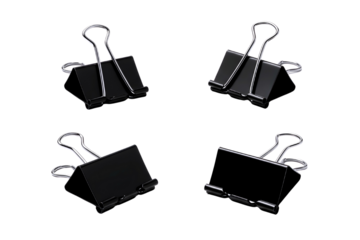 Four black binder clips isolated on transparent background