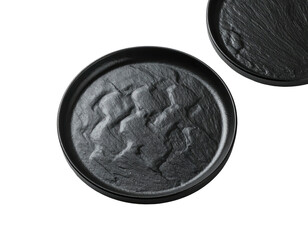 Two dark gray circular plates, textured like stone