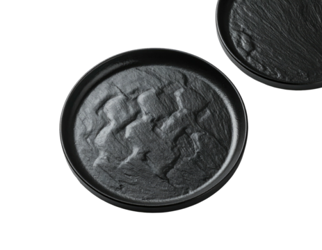 Two dark gray circular plates, textured like stone