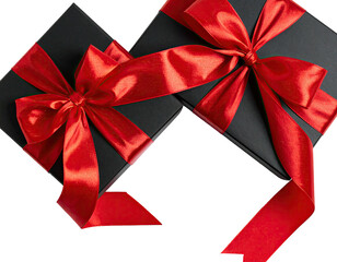 Two black gift boxes with red satin ribbons