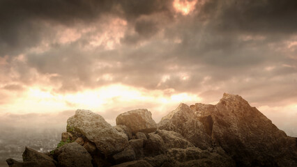 Pile of large rocks on the ground with dramatic sky background. The scene is scary and mysterious. Mockup. Copy Space. Wallpaper or Halloween background