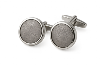 Cufflinks with intricate wavy pattern, isolated on transparent background.