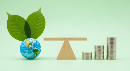 Sustainable, Green investment, green finance, and eco-friendly economic growth. Coin money Stack and Green Leaf Globe balanced on a scale