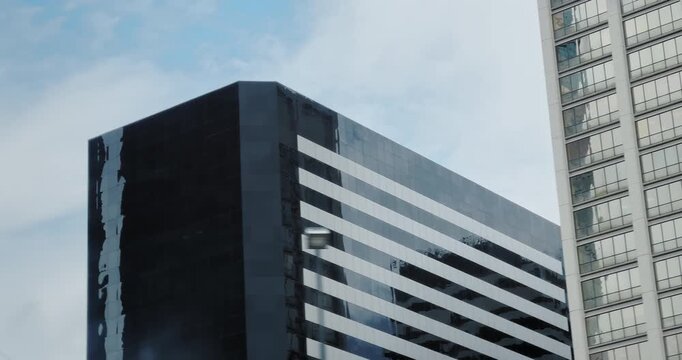 City buildings from moving car window