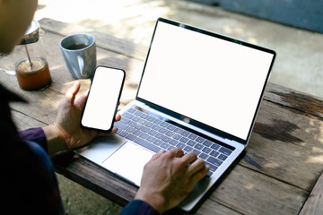 computer screen,mobile phone blank mockup.work using laptop texting mobile.white background for advertising,contact business search information on desk in cafe.marketing,design