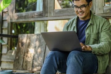 asian man work using computer hand typing laptop keyboard contact us.student study learning education online.adult professional people chatting search at office.concept for technology device business