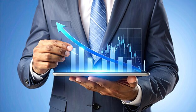 Businessman in suit holding tablet with upward trending graphs
