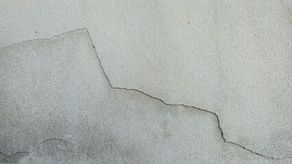 Old grey concrete wall, cracked, broken, stained, building wall, house wall, damaged house...