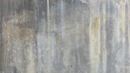 Old grey concrete wall with stains, uneven color, building wall, house, shop, and building wall texture image.