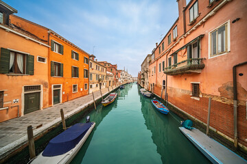 Quiet boats along canals of Cannaregio in Venice, Italy