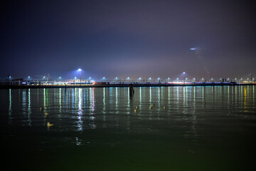 Long exposure captures light trails from trains and planes in Venice