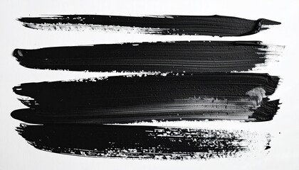 Black paint brushstrokes on white background