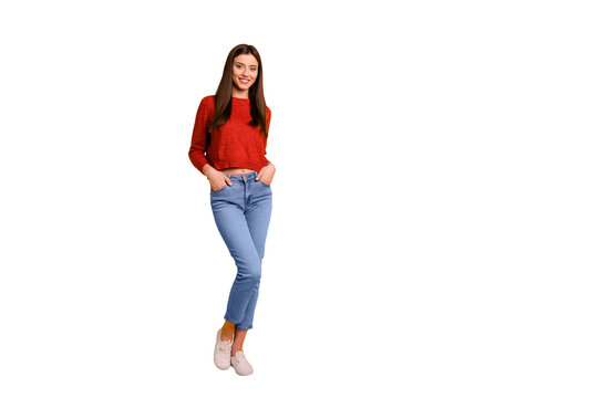 Full length body size photo of cute nice attractive millennial youngster with hands in pockets standing near empty space smiling toothily isolated over vivid color background