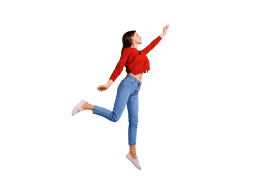 Full length photo of positive cheerful lovely girl jump hold hand want catch her flying parasol star wear good looking clothing isolated over yellow color background - Powered by Adobe