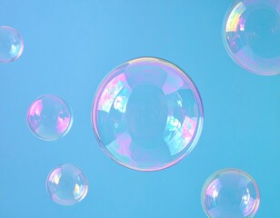 Pastel-hued soap bubbles against a light-blue background