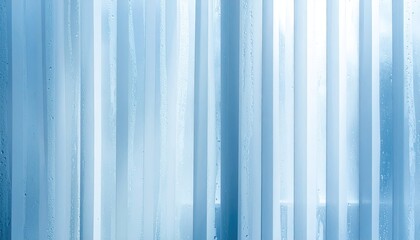 Light-blue sheer curtains, slightly damp, with vertical lines, letting in soft light
