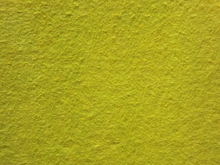 The textured surface is green, light green, pistachio color, herbal color as a background. Felt. High quality photo