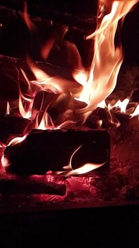 fire burning at night in fire pit super slow motion video