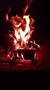 fire burning at night in fire pit, slow motion video