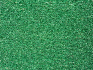 The textured surface is green, light green, pistachio color, herbal color as a background. Felt. High quality photo