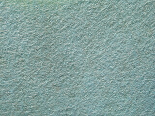 The textured surface is blue as a background. Felt. High quality photo