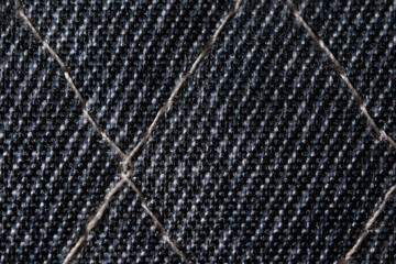 Naklejka premium Closeup of Quilted Dark Denim Fabric Texture