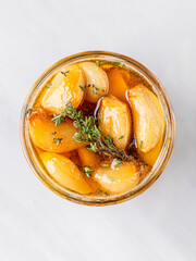 Creamy feta cheese dip with honey and roasted garlic in a rustic bowl, served as an appetizer or party food concept.