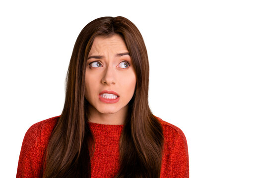Close up photo of confused afraid girl cant remember important information feel panic look try think wear red pullover isolated over yellow color background