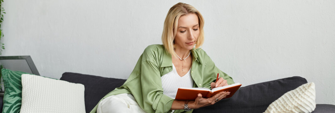 Beautiful adult woman writing in her journal while enjoying a cozy moment at home