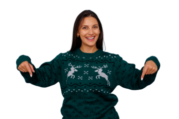 Woman in green christmas sweater pointing down on transparent background, smiling, presenting holiday offer