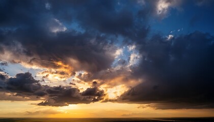 Fototapeta premium Dark Moody Sky With Sunlit Clouds At Sunset