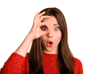 Close up photo of amazed astonished girl with her okay sign near eye look watch like spy see...