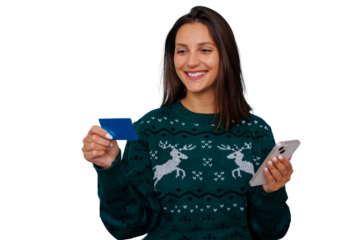 Woman holding credit card and smartphone, enjoying online holiday shopping, smiling for festive season purchases