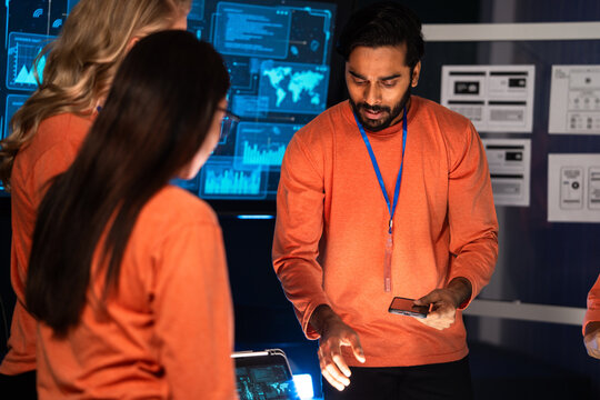 Startup team discussing ideas for mobile application design, analyzing user interface and digital strategies, colleagues analyzing data, developing innovative technology, teamwork and problem solving