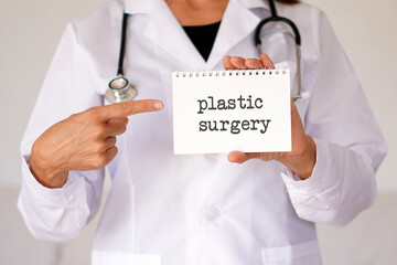 medical and beauty concepts. plastic surgery. female doctor holding a notebook