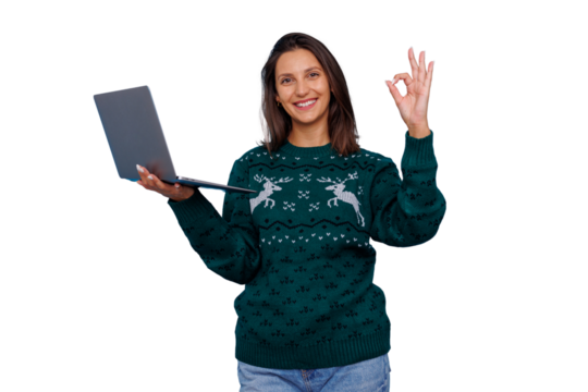 Woman holding laptop and making ok gesture, smiling in festive reindeer christmas sweater, transparent background