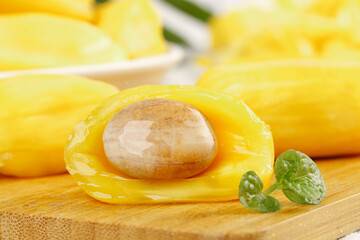 Fresh Yellow Pineapple Slices with Honey Flesh on Bamboo Board