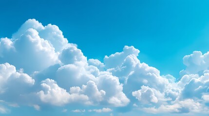 Vast blue sky filled with fluffy, white cumulus clouds on a bright sunny day